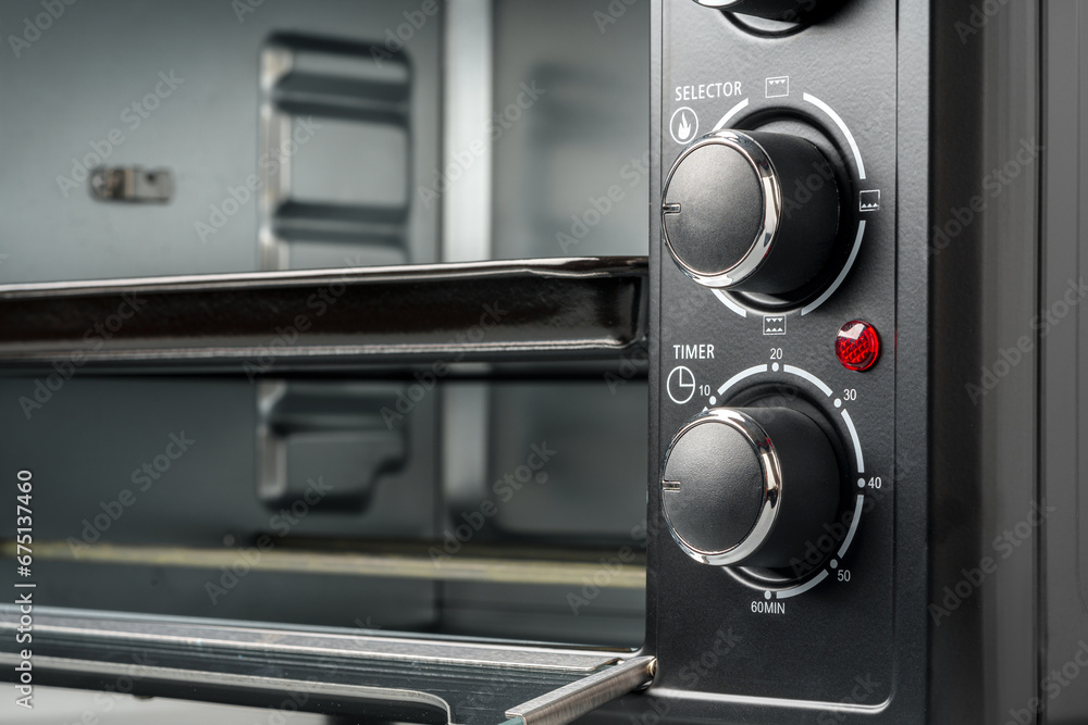 Close up of black mini electric oven home appliance Close up of black mini electric oven home appliance