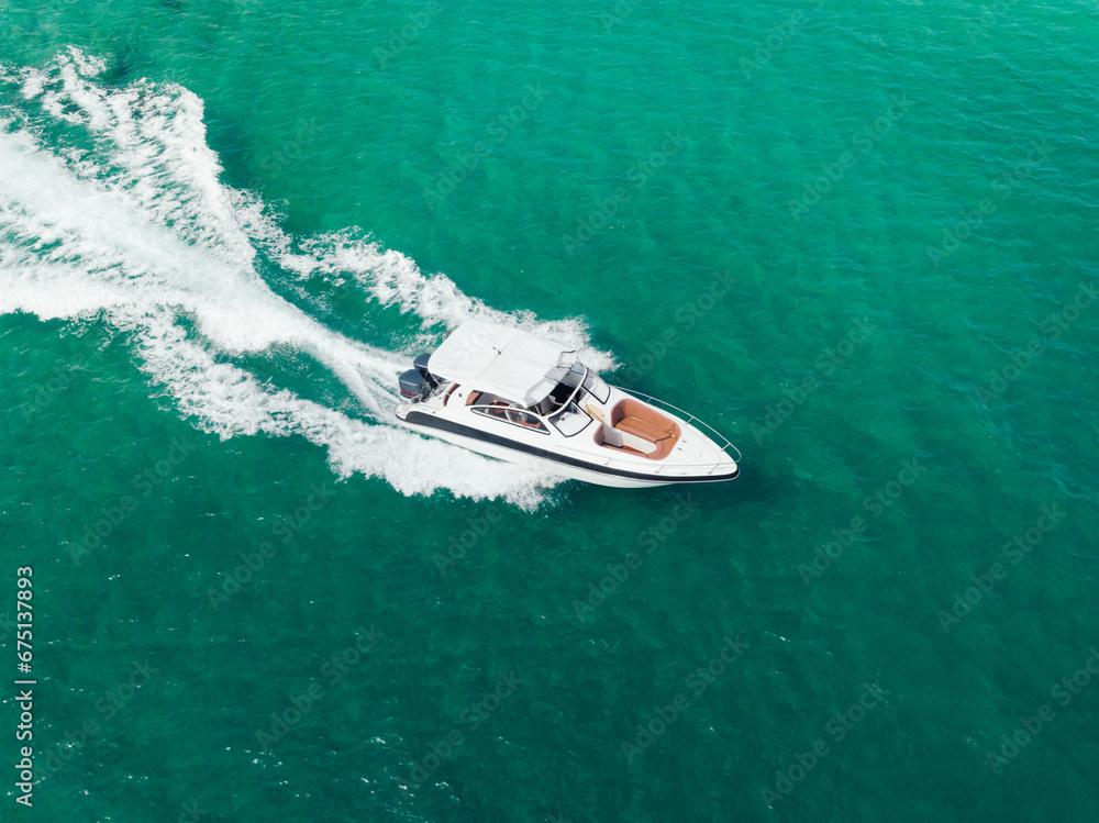 Aerial view of Speed boat at high speed in the aqua sea, Drone view. Aerial view of Speed boat at high speed in the aqua sea, Drone view.