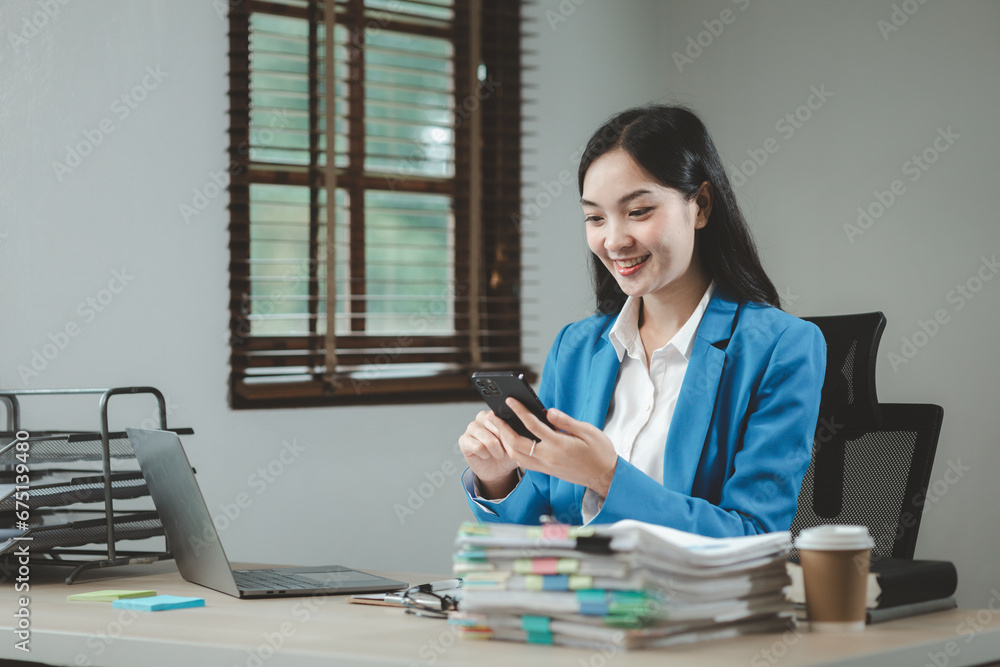 Businesswoman is talking on the phone with a partner, Businesswoman is sitting and working in the office, An entrepreneur is talking on the phone with a company customer, office idea. Businesswoman is talking on the phone with a partner, Businesswoman is sitting and working in the office, An entrepreneur is talking on the phone with a company customer, office idea.