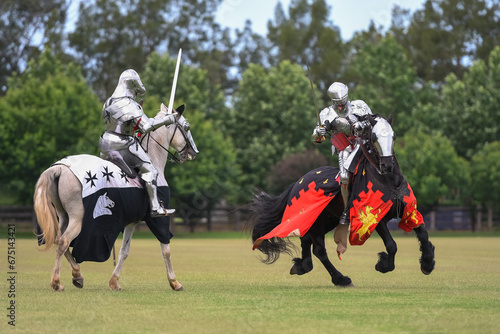 Knight jousting. Medieval knights during a jousting tournament photo