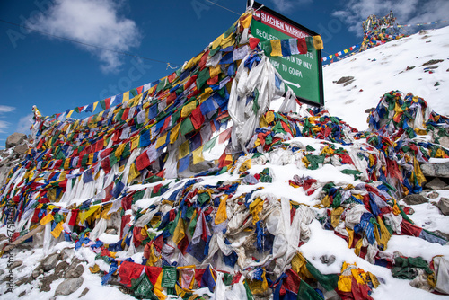 The beautiful views of Colorful Tibetan prayer flags on Khardung La or Khardung Pass