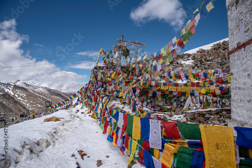 The beautiful views of Colorful Tibetan prayer flags on Khardung La or Khardung Pass photo