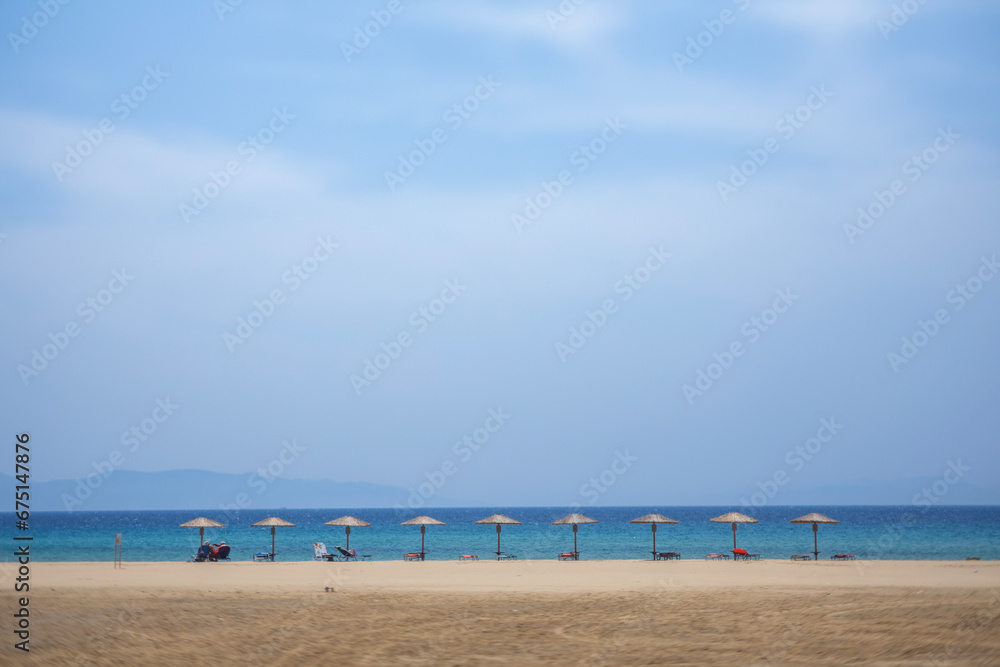 maragkas beach in naxos umbrellas