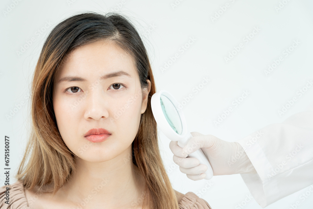 skin problem and beauty of asian girl. Dermatologist use magnifying glass look itchy skin from skin allergic, steroid allergy, sensitive skin, chemical allergy, rash, insect bites, Dermatitis. skin problem and beauty of asian girl. Dermatologist use magnifying glass look itchy skin from skin allergic, steroid allergy, sensitive skin, chemical allergy, rash, insect bites, Dermatitis.