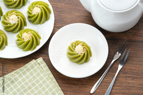 Kue Kaswi Pandan, traditional cake made from tapioca flour and pandan leaf, topping with sesame seed 