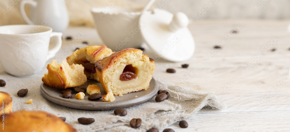 Pasticciotto leccese pastry filled with egg custard cream and sour cherry jam on a plate close up Pasticciotto leccese pastry filled with egg custard cream and sour cherry jam on a plate close up