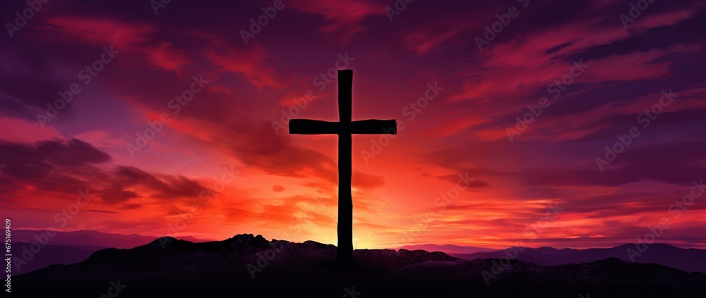 Silhouette of a cross on against a colorful sunset sky Silhouette of a cross on against a colorful sunset sky