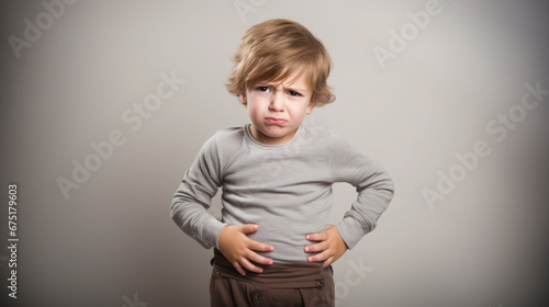 sad little boy holding his stomach, illness, cramps, health, color background, stomach-ache, abdominal, griping, bellyache, tummy-ache, gripes, portrait, ill, child, kid, baby, toddler, son, cry