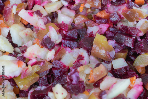 Vegetable salad with beets, carrots, onions and potatoes close up