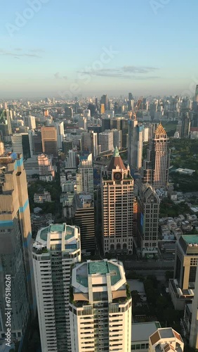 Panorama of skyscrapers at sunrise in downtown Bangkok, Thailand photo