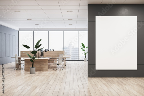 Fototapeta Naklejka Na Ścianę i Meble -  Modern coworking office interior with blank white mock up banner on wall, panoramic windows and city view, daylight, wooden flooring, furniture and decorative plant. 3D Rendering.