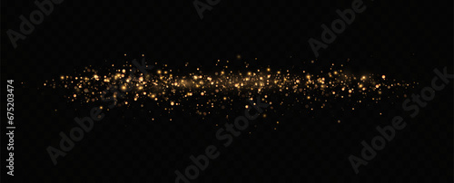 Golden sequins glow with many lights. Glittering dust. Luxurious background of golden particles.