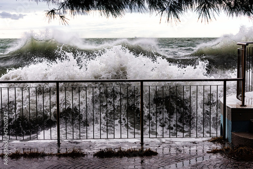 barcola beach with heavy stormy sea photo