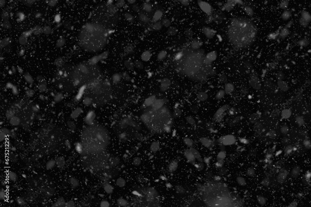 Flurry of snowflakes cascading through the air. Falling snow background.