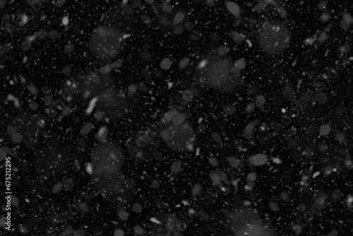 Flurry of snowflakes cascading through the air. Falling snow background.