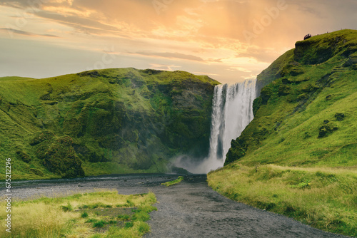 Famous Skogafoss waterfall on Skoga river. Exploration and adventure concept.