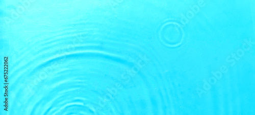 Transparent blue color water ripple with copy space. Defocused and blurred surface with splash  bubble and shining.