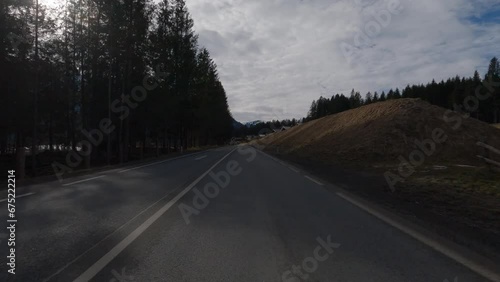 POV FRONT VIEW DRIVING PLATE car driving on winter roads in Austrian Alps (ID: 675222214)