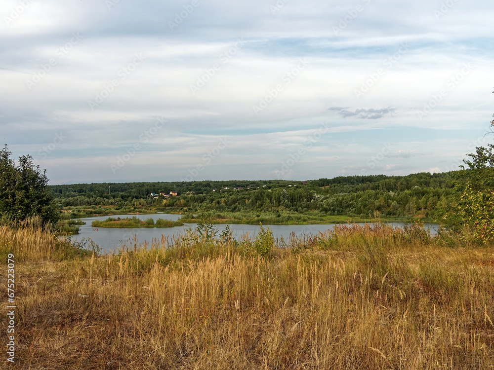 Forested river banks in summer