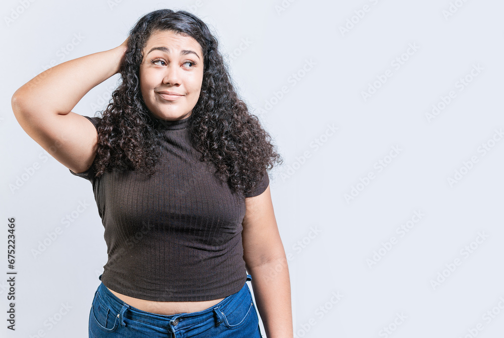 Young woman scratching her head with doubtful expression. People scratching heads with indecisive expression isolated Young woman scratching her head with doubtful expression. People scratching heads with indecisive expression isolated