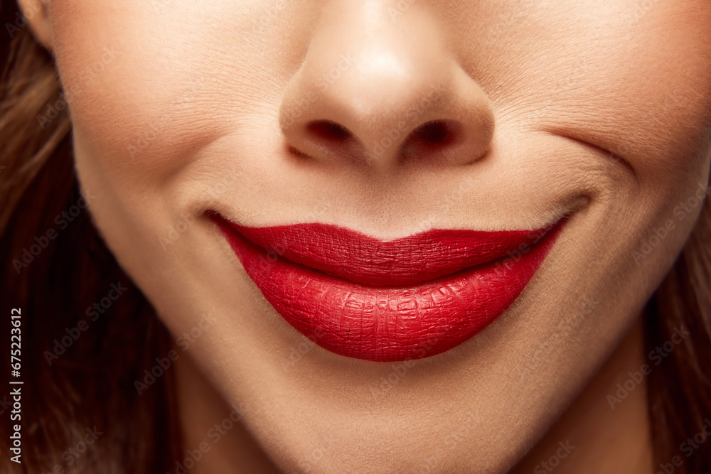 Fototapeta premium Smiling woman. Cropped close up portrait of beautiful young girl with pout lips. Lip matte lipstick. Skin care routine.