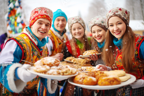 Slavic national festival Maslenitsa or shrovetide. Women in headscarf eat big tasty pancakes, have fun on winter pancake holiday week.