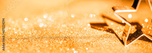 Sparkling Gold Defocused Bokeh Background with Star. Luxury Golden Background.