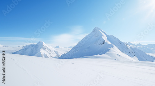 Wide angle view landscape of white snowy mountains range with clear blue sky during cold winter. Nature concept for extreme lifestyle product background  © myboys.me