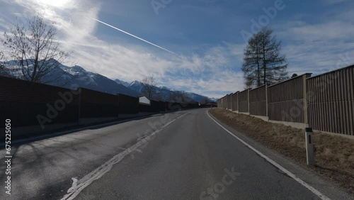 POV FRONT VIEW DRIVING PLATE car driving on winter roads in Austrian Alps (ID: 675225050)
