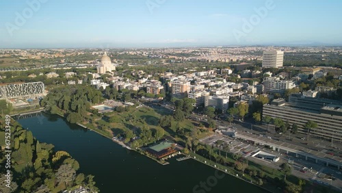 Ascending Drone Shot Reveals EUR Lake Park on Beautiful Day in Rome, Italy