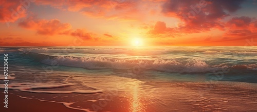 The background of the summer beach landscape was adorned with vibrant hues of orange as the sun set casting a warm and gentle light across the water creating a breathtaking scene against the