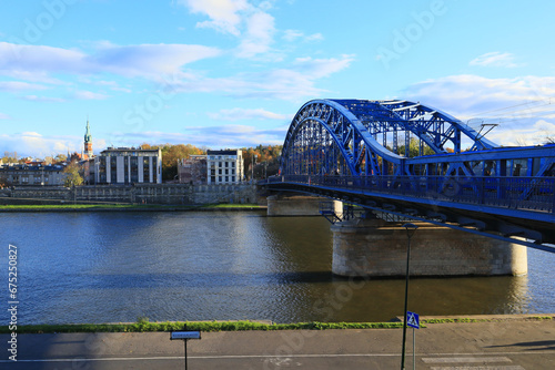 View of the bright blue Józef Piłsudski Bridge on a sunny autumn day