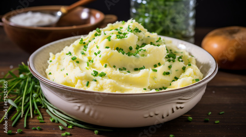 Fluffy mashed potatoes with chives and butter photo