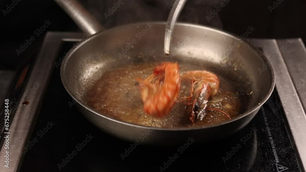Delicious large shrimps are fried in a pan. Close up Delicious large shrimps are fried in a pan. Close up