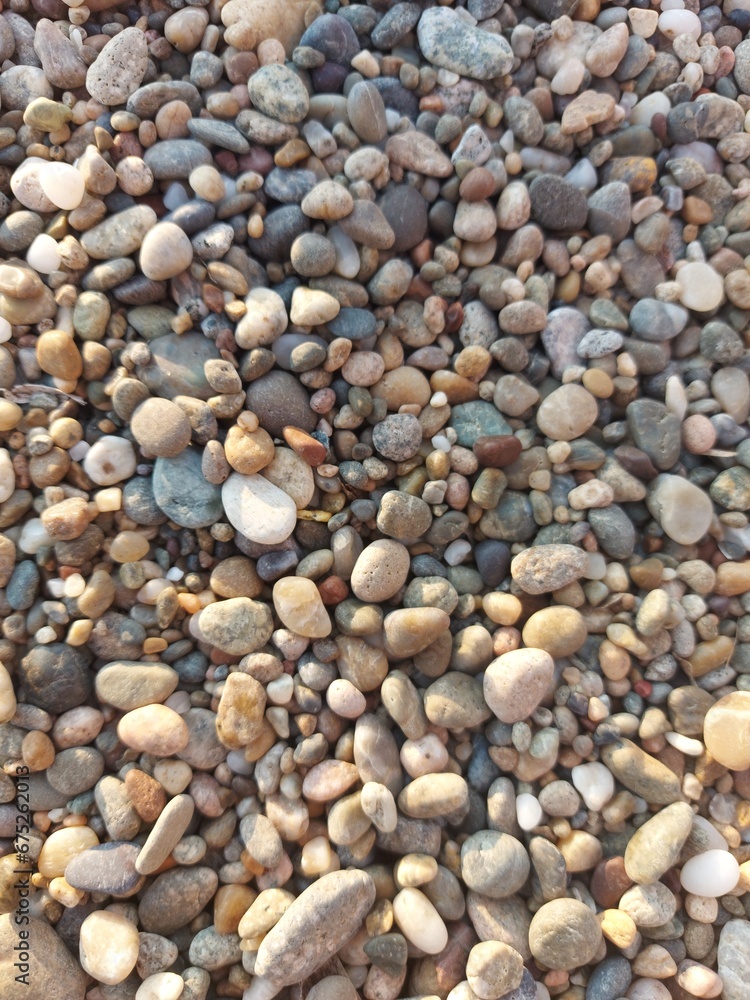 Naklejka premium stone, pebble, beach, stones, texture, rock, pebbles, nature, rocks, gravel, pattern, sea, round, smooth, abstract, textured, natural, sand, grey, shingle, macro, wet, gray, white, backgrounds