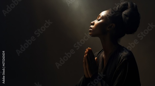 Spiritual black woman in prayer. The concept of deep faith © BraveSpirit