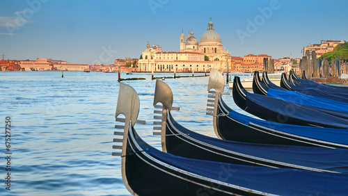 Gondolas on Grand Canal with Basilica Santa Maria della Salute in Venice as a backdrop.