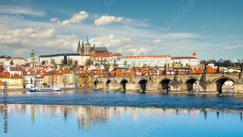 Charles Bridge, St. Vitus Cathedral and other historical buildings in Prague, panorama from the opposite river bank
