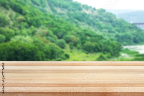 Empty blank wooden table on nature background. © BillionPhotos.com