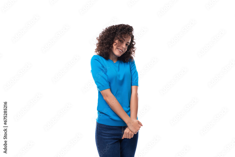 cute young curly brunette woman with shoulder-length hair is wearing a blue t-shirt cute young curly brunette woman with shoulder-length hair is wearing a blue t-shirt
