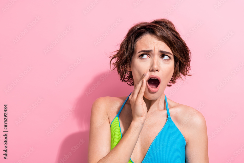 Photo of shocked impressed lady wear green blue tank top arm lips telling gossips empty space isolated pink color background Photo of shocked impressed lady wear green blue tank top arm lips telling gossips empty space isolated pink color background