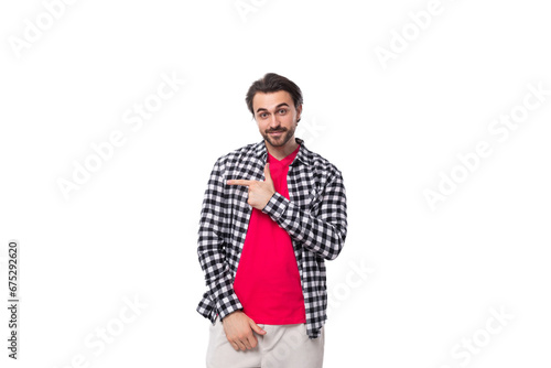 young well-groomed brunette caucasian man with a stylish hairstyle and beard on a white background