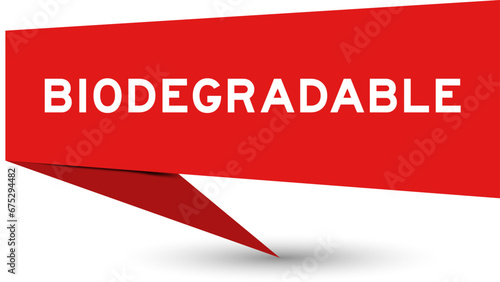 Red color speech banner with word biodegradable on white background