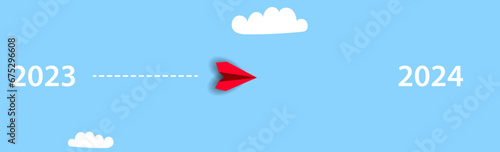 Paper red plane going from 2023 to 2024.2024 annual plan idea concept. business creativity new idea discovery innovation technology