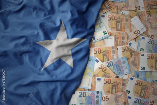 Wallpaper Mural colorful waving national flag of somalia on a euro money background. finance concept Torontodigital.ca