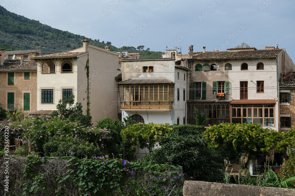 Medieval historic old house facades architecture in small alleys, streets and backstreets of Soller town on Balearic Island Mallorca, tourist destination in mountains station of Orange Express train