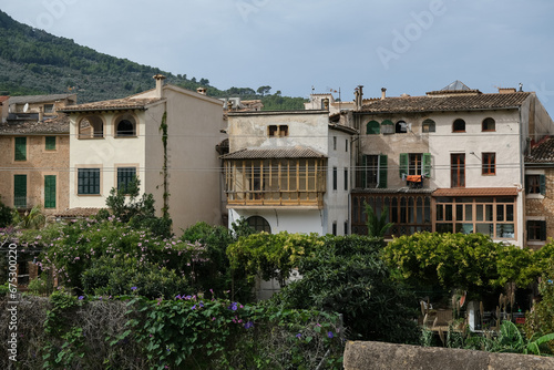 Medieval historic old house facades architecture in small alleys, streets and backstreets of Soller town on Balearic Island Mallorca, tourist destination in mountains station of Orange Express train © Tamme