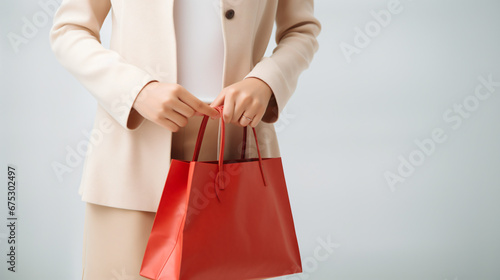Asian woman hands holding shopping bags