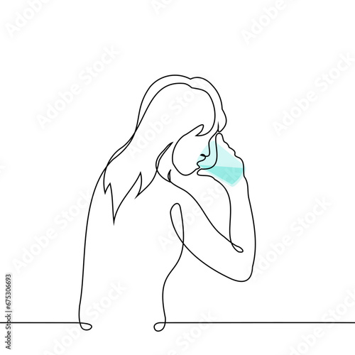 woman drinks water from a glass - one line art vector. concept quench thirst, water consumption