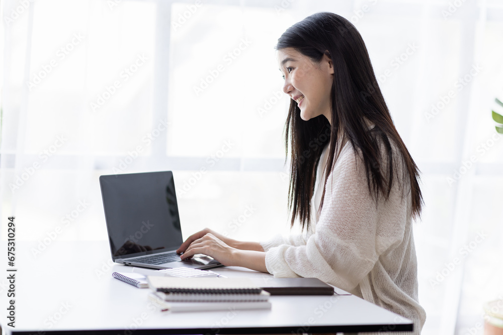 Portrait of Young Asian woman hand freelancer is working her job on computer tablet in modern office. Doing accounting analysis report real estate investment data, Financial and tax systems concept. Portrait of Young Asian woman hand freelancer is working her job on computer tablet in modern office. Doing accounting analysis report real estate investment data, Financial and tax systems concept.